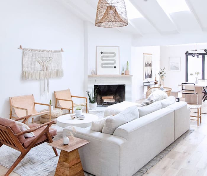 modern living room with white sofa bed wood chairs and side table and pendant lamp