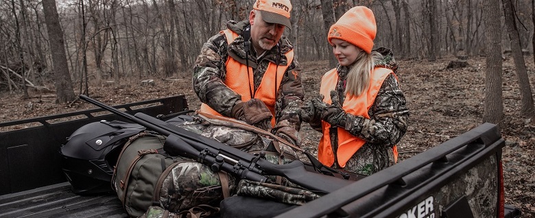 Father and doughter preparing for a hunt