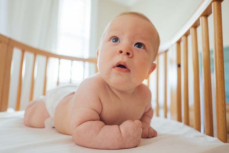 baby in sleeping cot